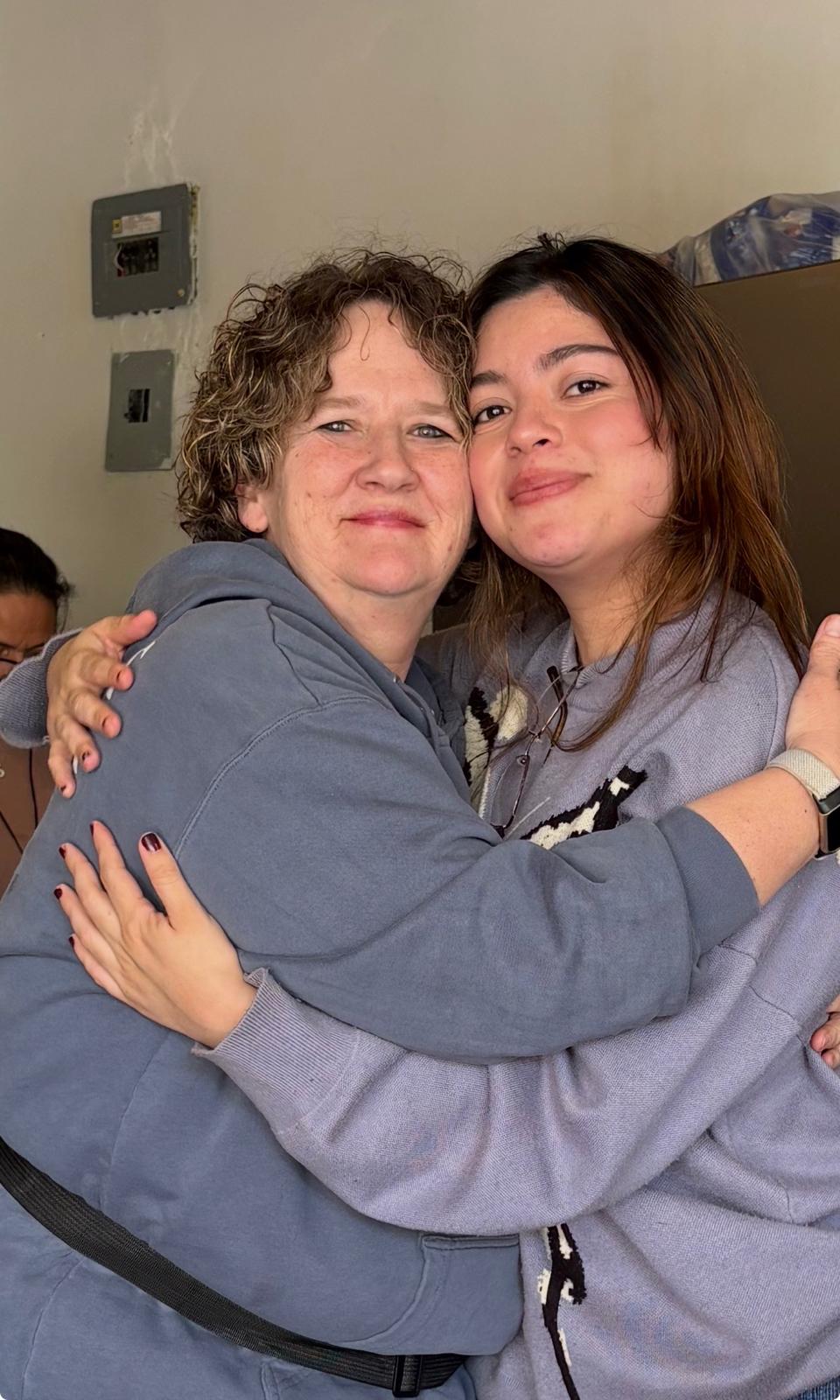 Celeste hugging a team member